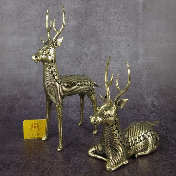Brass deer pair Dokra art figurines with detailed antlers captured in studio lighting for premium home decor display