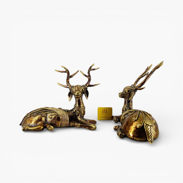 Side view of handcrafted brass deer decor pair