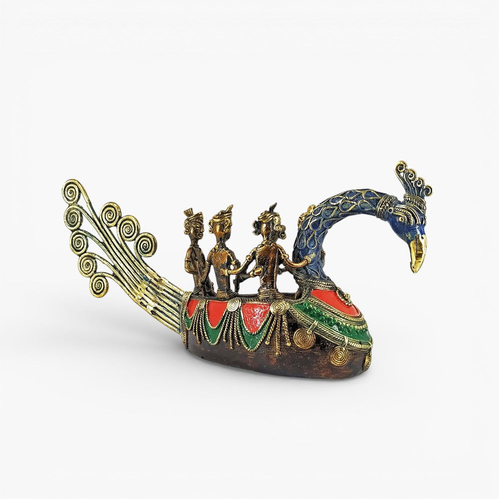 Bastar art brass peacock boat statue with multicolor detailing shown in side profile showcasing fishermen figures and peacock form