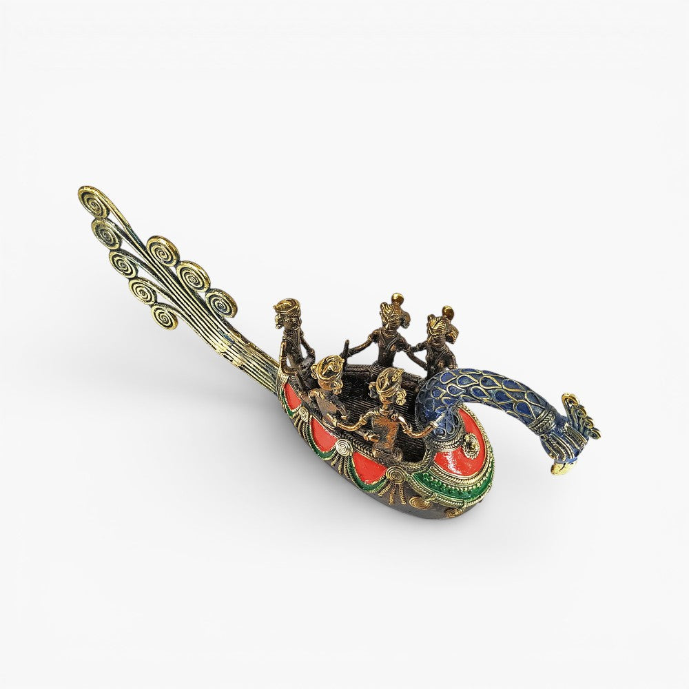 Top angled view of handmade Bastar art brass peacock boat statue showcasing five fisherman figures seated inside the boat