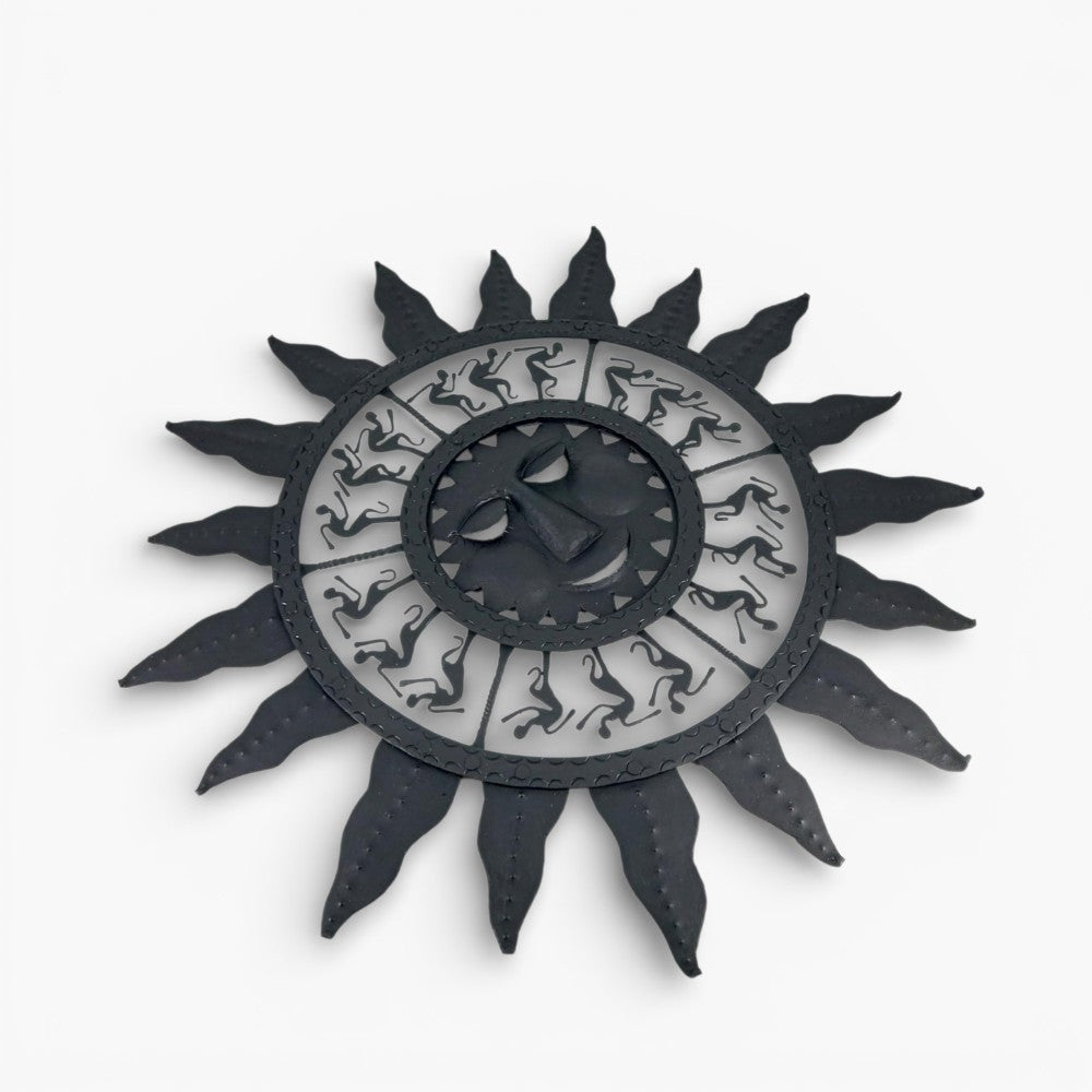 Front view of handmade Bastar iron sun mask wall hanging showing 24 inch diameter with traditional tribal sun design