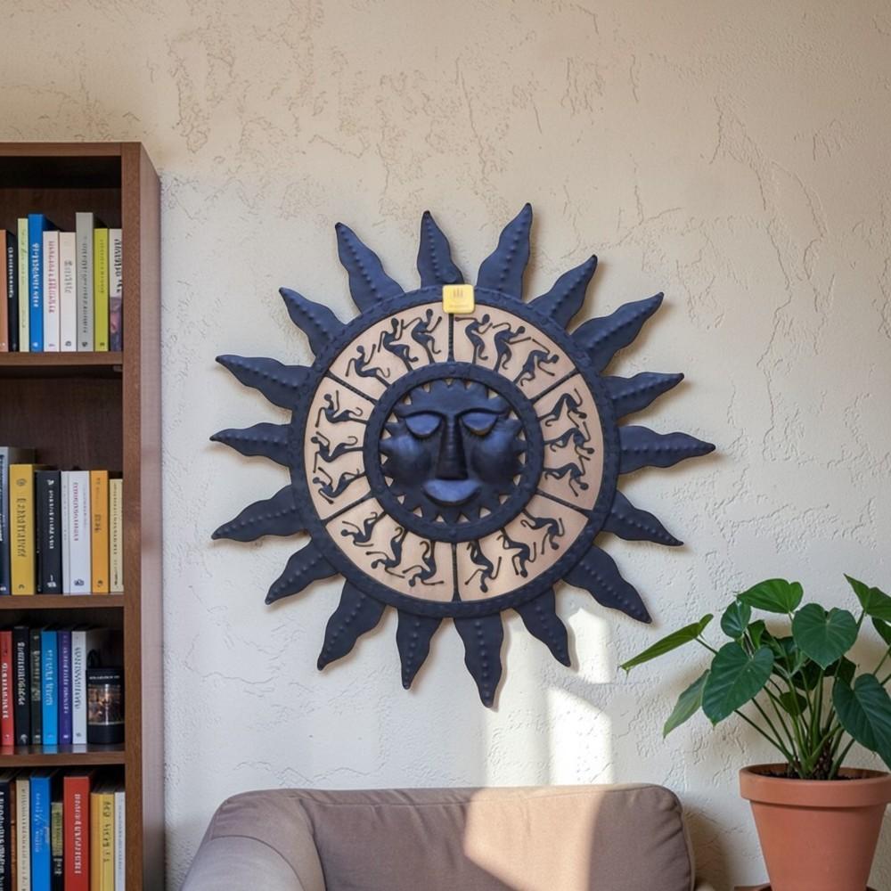 Handmade Bastar iron sun mask wall hanging in black displayed on wall, symbolizing energy and positive vibes for home decor