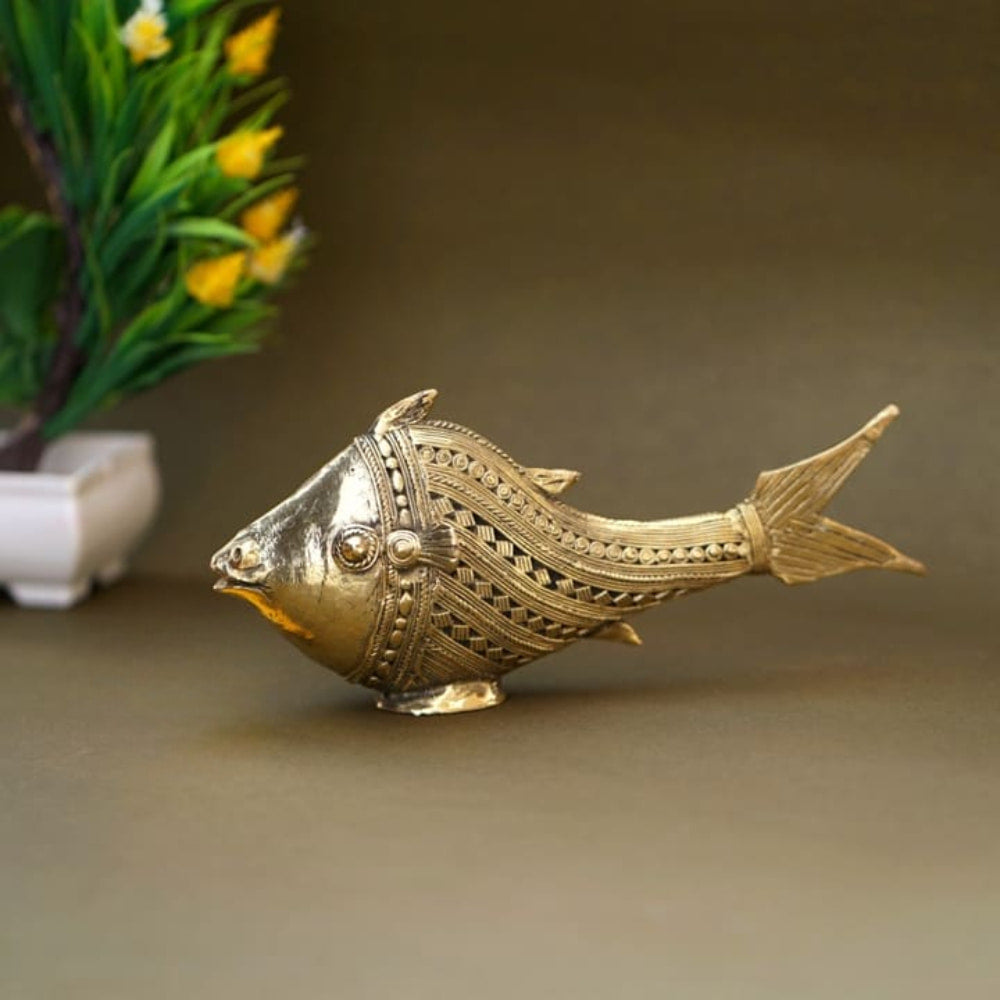 Handcrafted Bastar Dhokra art brass fish figurine in golden finish displayed in a lifestyle setup for home décor Aside table styling