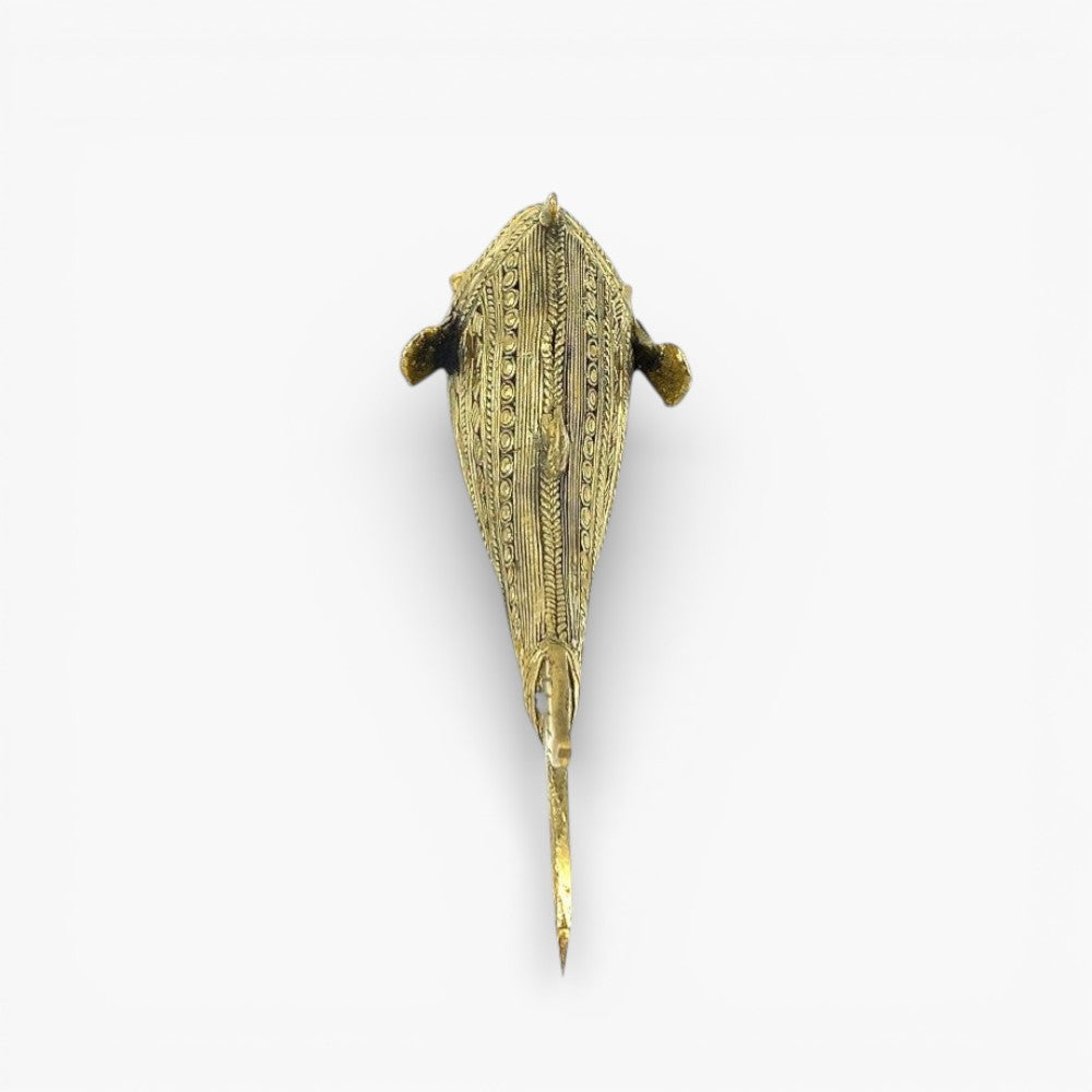 Top view of Bastar Dhokra art brass fish figurine highlighting hand-engraved patterns and elongated sculptural form