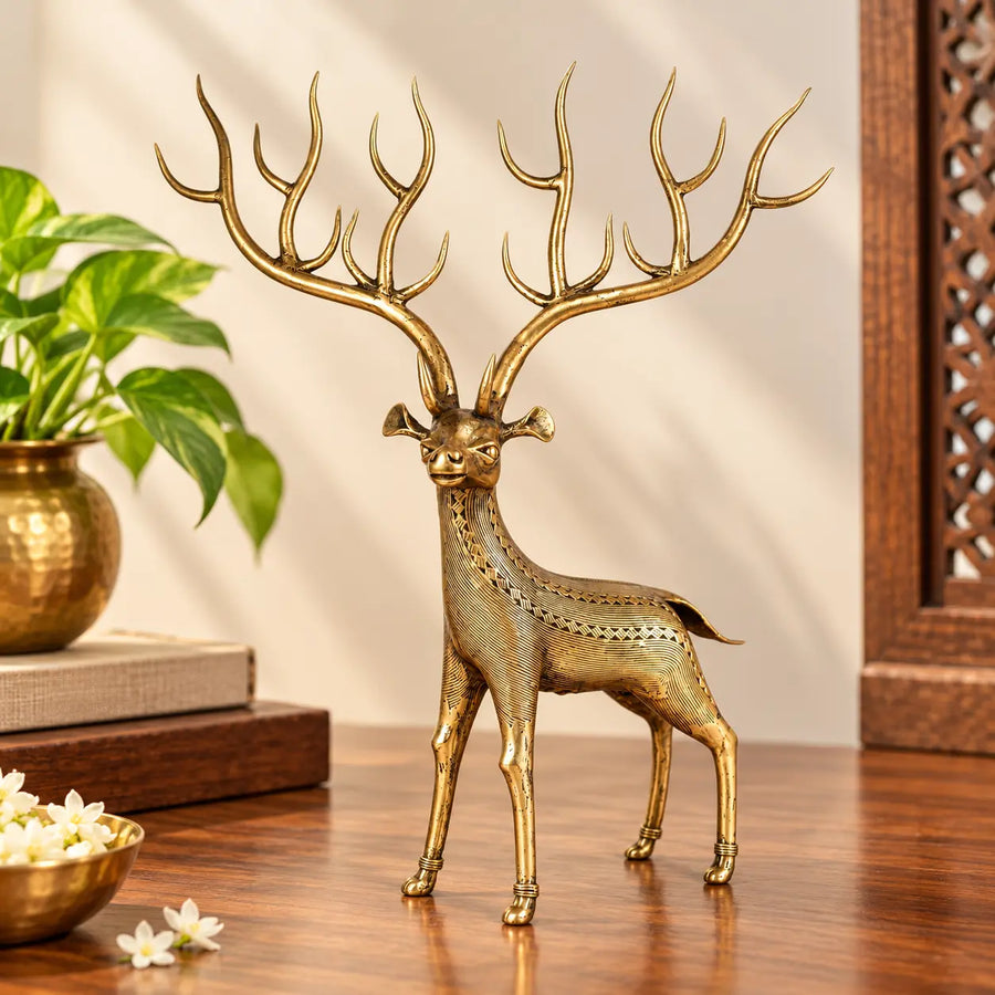 Bastar Dhokra brass multi antler deer sculpture with detailed line engraving, handcrafted decor piece on a wooden table