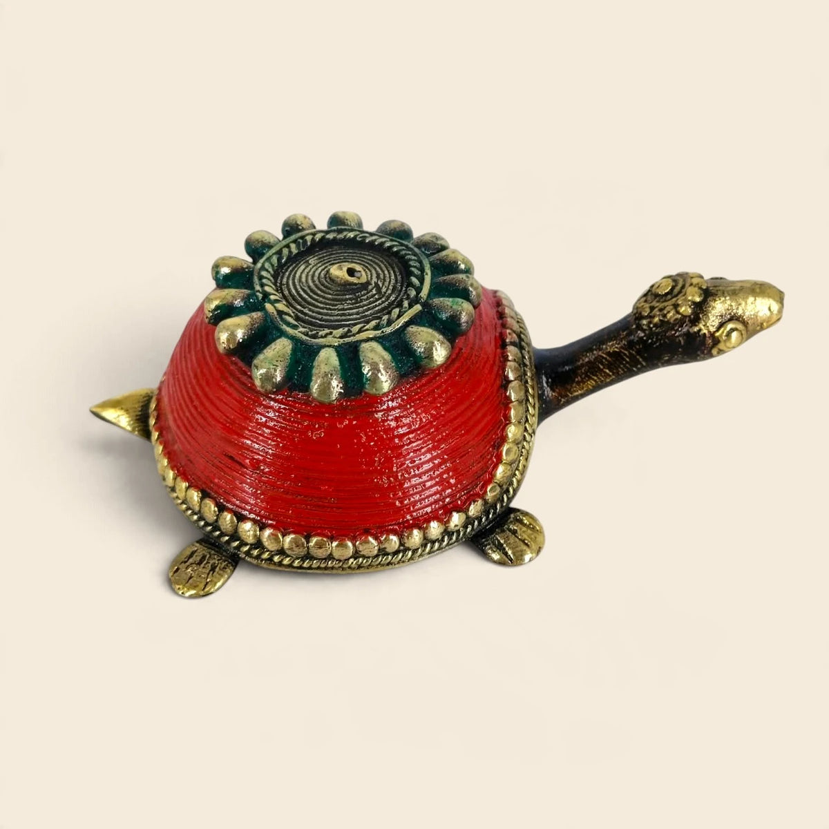 Three-quarter view of red Bastar Dhokra brass turtle box with beaded brass border and long antique-finish neck