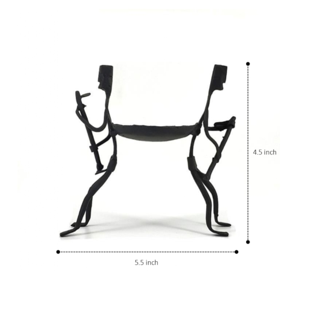 Minimal black iron tea light holder with symbolic human form