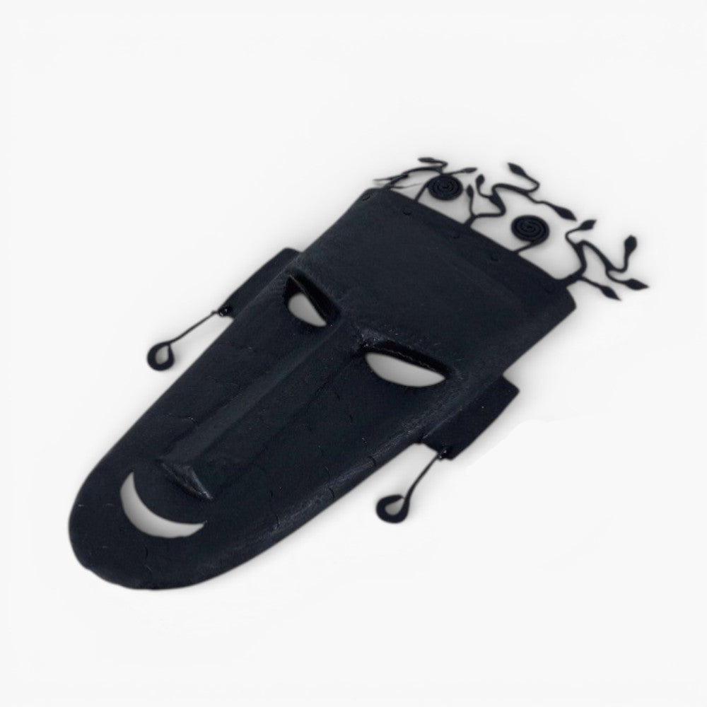 Handcrafted Bastar iron tribal wall mask with abstract tree design, black wrought iron finish, angled studio product view