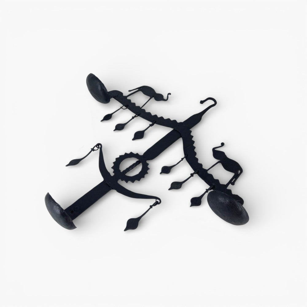 Top view flat lay of handmade Bastar iron elephant design wall hanging showing diya holders and hanging details