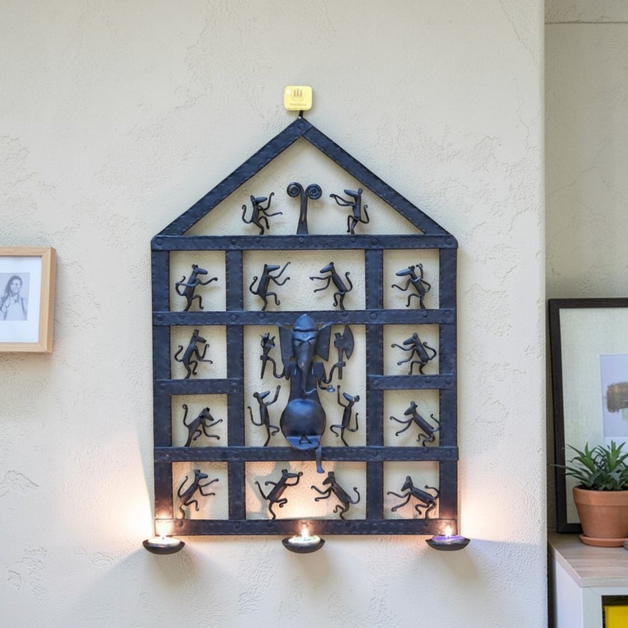 Handcrafted Bastar iron art Ganesha wall hanging black metal tribal wall decor with diya holders lifestyle display