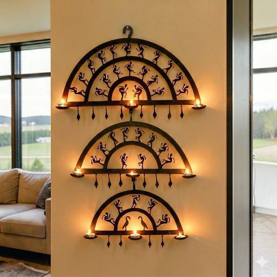 Handmade Bastar iron art half circle wall hanging displayed on a wall with lit diyas, featuring layered semicircular wrought