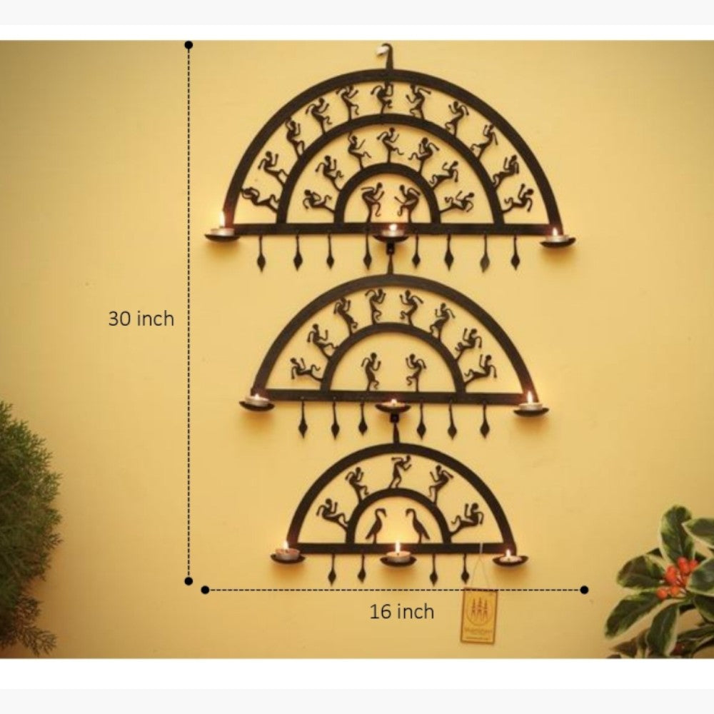Handcrafted Bastar iron art half circles wall hanging shown on a wall with dimensions marked, highlighting vertical arrangement, nine diya holders, and festive wall decor appeal