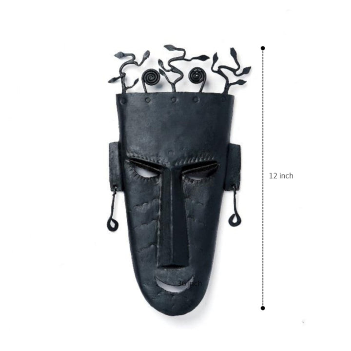 Front view of handmade Bastar iron tribal wall mask with abstract tree design showing 12 inch height for wall hanging decor