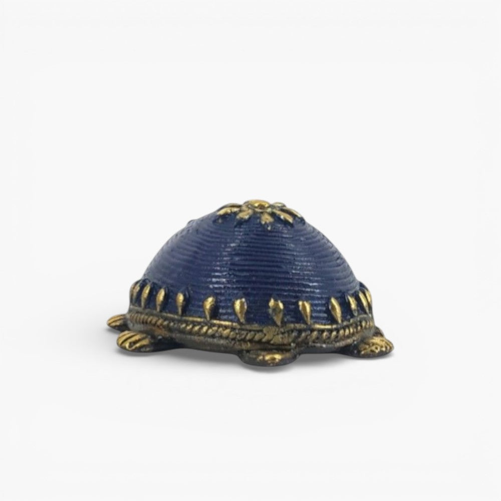 Front view of handcrafted bell metal turtle figurine in blue finish highlighting sculpted head and antique brass detailing