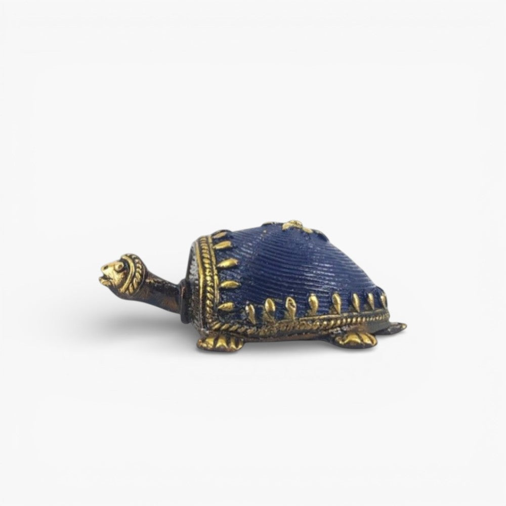 Side profile of handmade Dhokra bell metal turtle figurine showcasing curved shell texture and fine artisan detailing