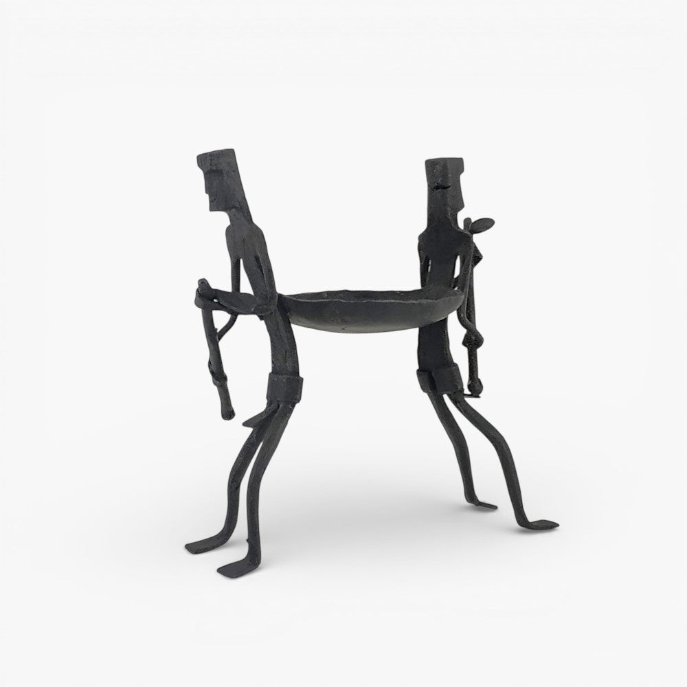 Side view of handcrafted Bastar Dokra art iron candle holder