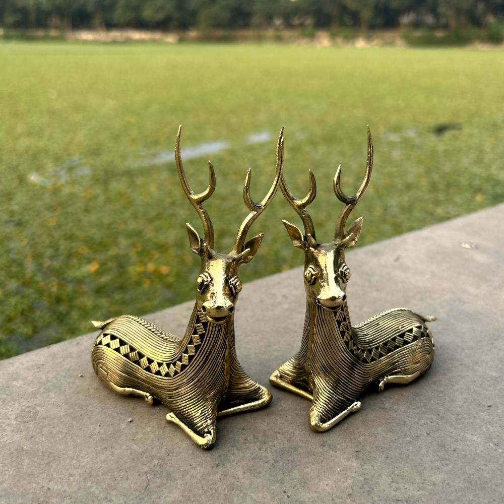 Side by side view of handcrafted brass sitting deer statues in traditional Bastar bell metal art