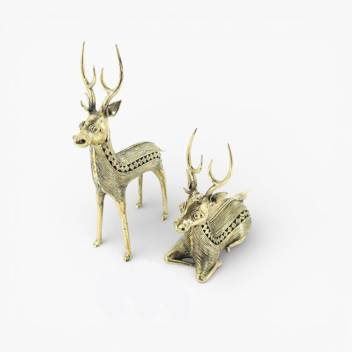 Handheld brass deer pair Dokra art figurines showing compact size and fine craftsmanship