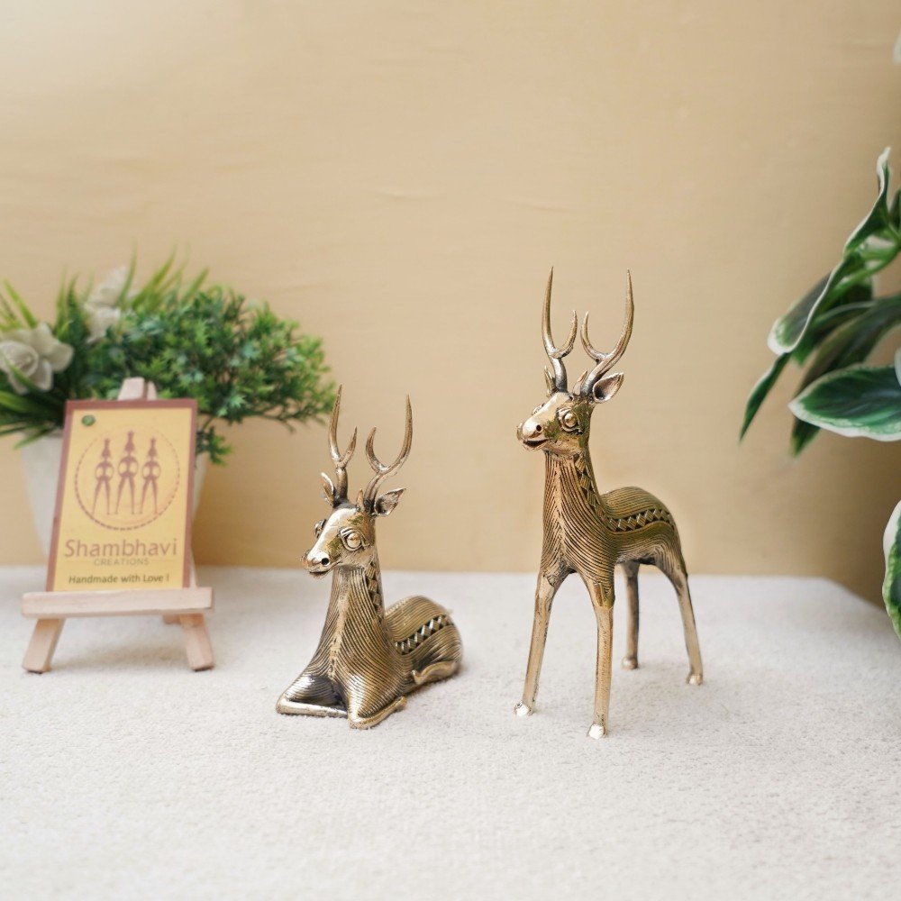 Golden brass deer statues handcrafted in Dokra art style displayed with indoor plants for living room decor styling