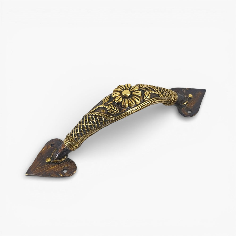 Handcrafted brass door handle with flower and lattice design in bronze finish showing intricate decorative metalwork