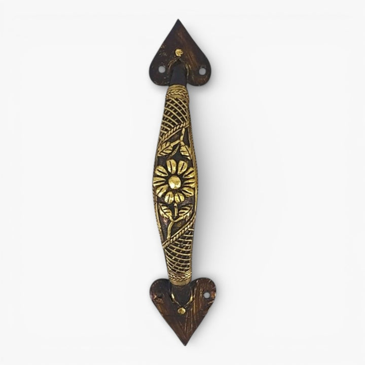 Front view of brass door handle featuring floral motif and lattice pattern crafted in Dhokra art style