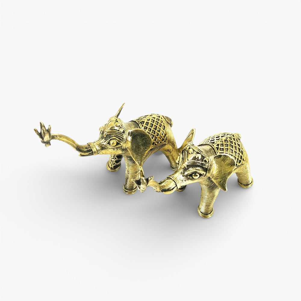 Golden brass elephant duo with lattice body detailing, top angled view dhokra art decor figurine
