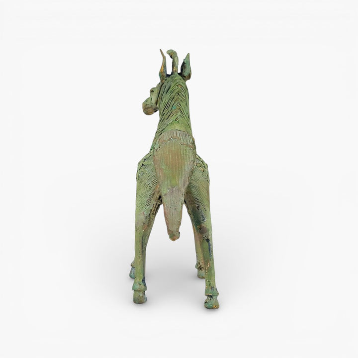 Back view of handcrafted brass horse statue showing tail form and traditional dhokra metal craft texture