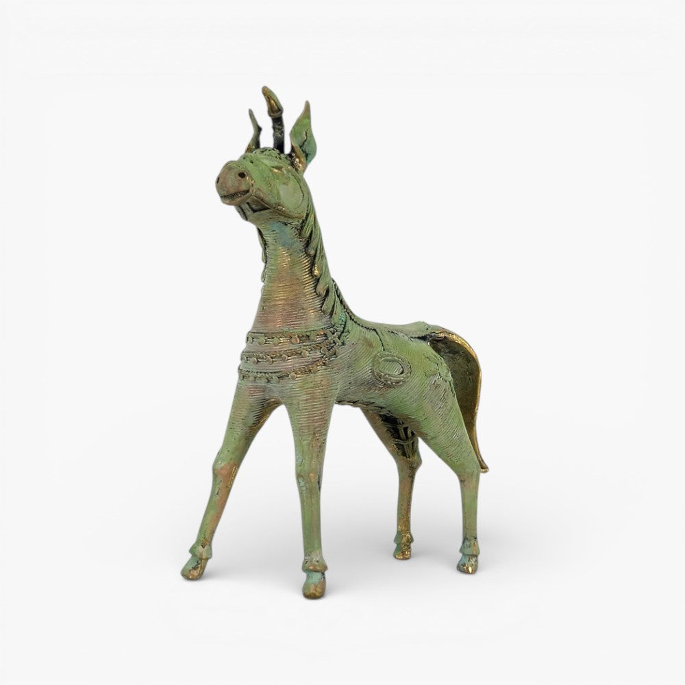Front three-quarter view of handcrafted brass horse statue in verdigris green finish with intricate dhokra metal textures