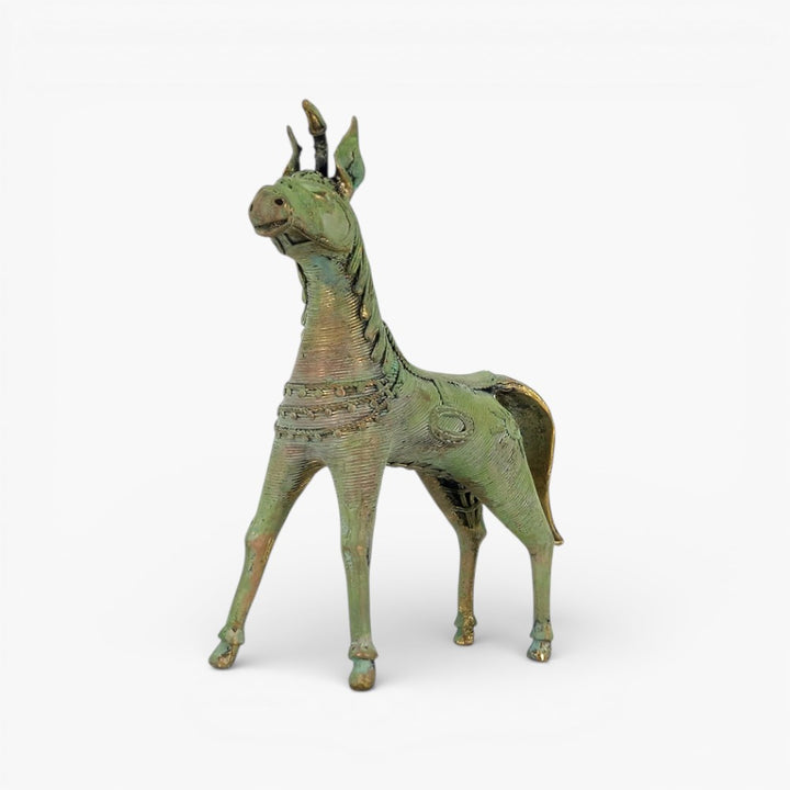 Front three-quarter view of handcrafted brass horse statue in verdigris green finish with intricate dhokra metal textures