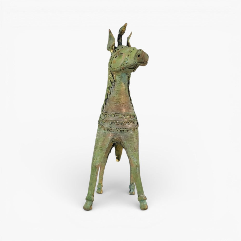 Front view of handmade brass sleek horse statue highlighting unicorn horn and ornamental chest detailing