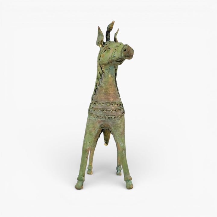 Front view of handmade brass sleek horse statue highlighting unicorn horn and ornamental chest detailing