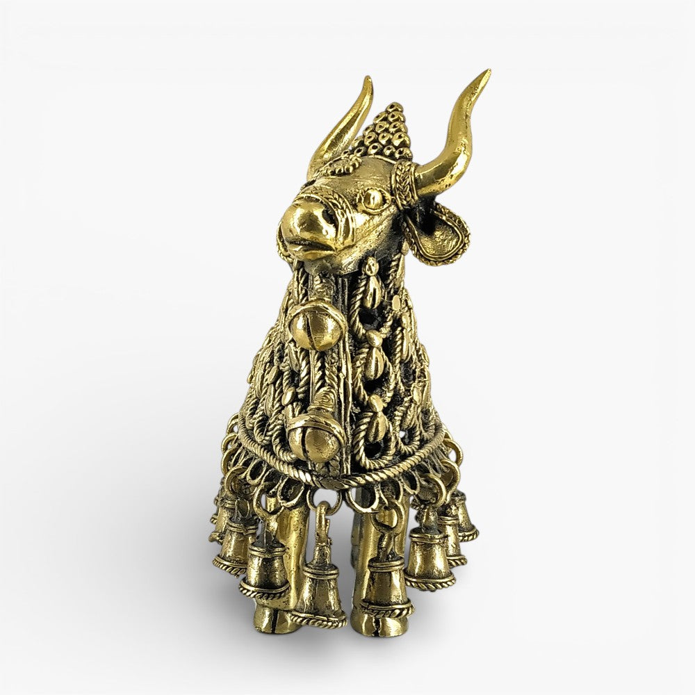 Close-up of brass Nandi sculpture with braided metal work