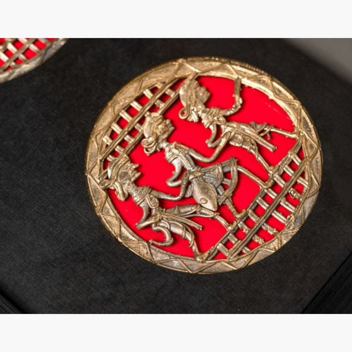 Close-up of single circular dancing motif in Circles of Celebration Bastar Dokra art brass wall frame, black and red 18 inch decor 