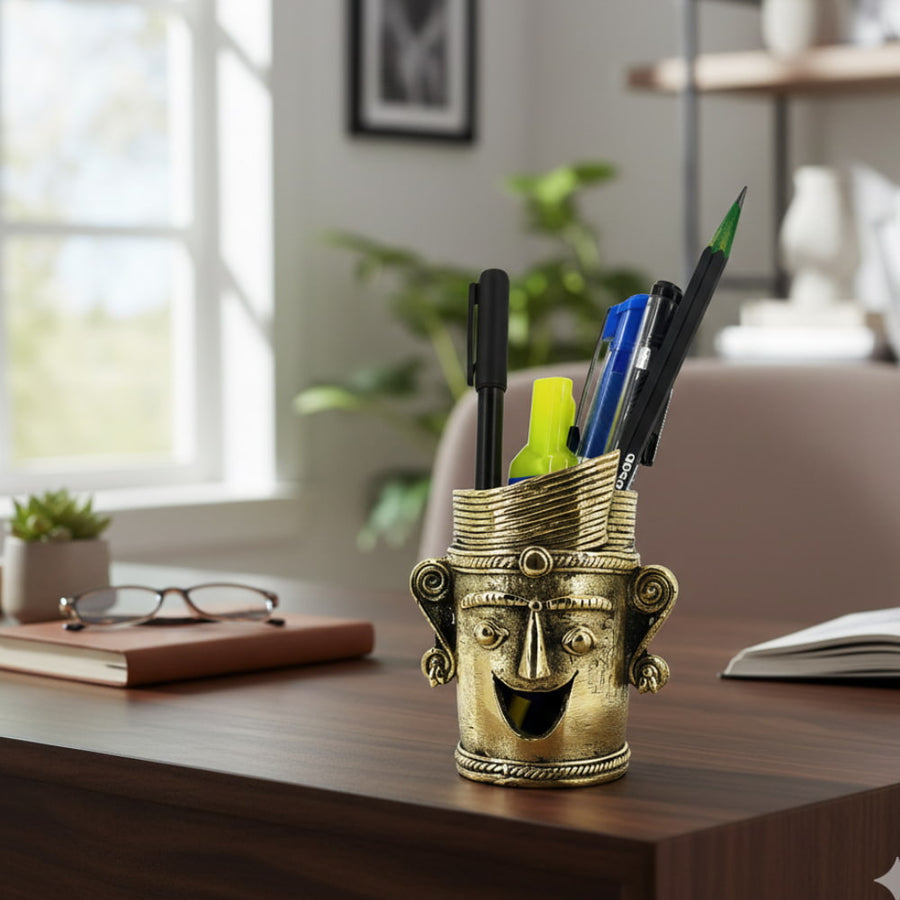 Crowned Smile Bastar Dokra art brass pen holder with expressive face design, golden finish handcrafted desk accent for office or study, 3.5 inch