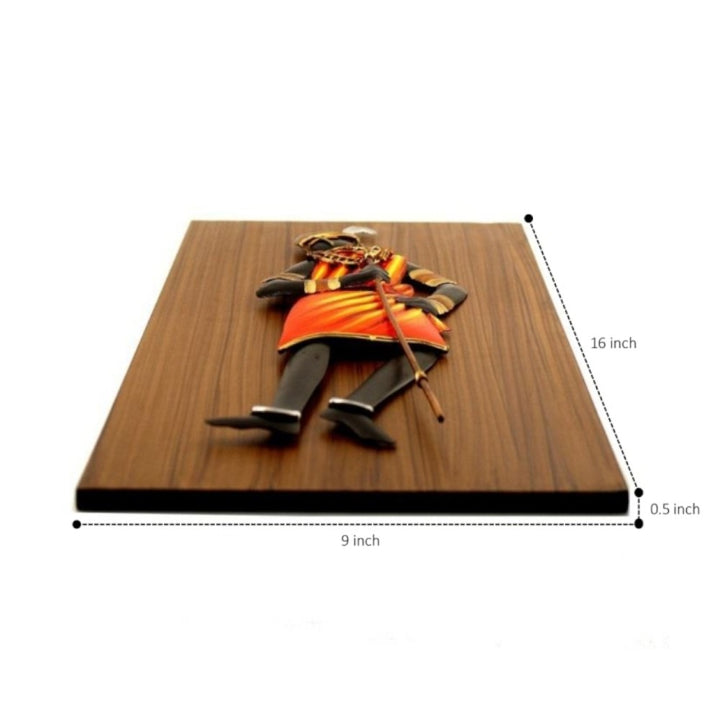 Angled view of Bastar iron craft dancing tribal woman wall art showing wooden base thickness and overall handcrafted structure