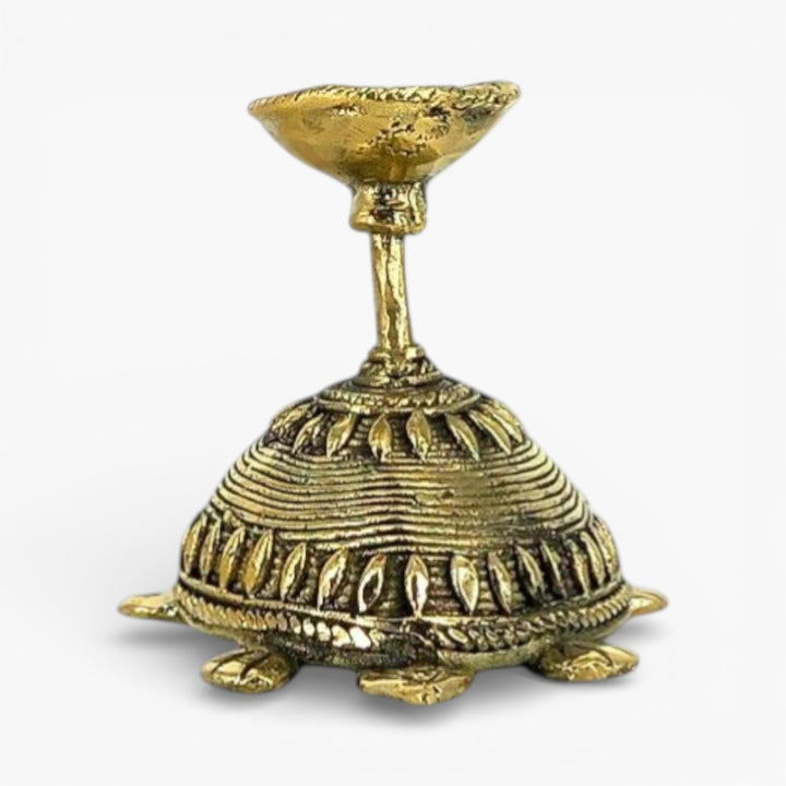 Studio view of bell metal tortoise diya handcrafted using Bastar Dhokra art for pooja room decor