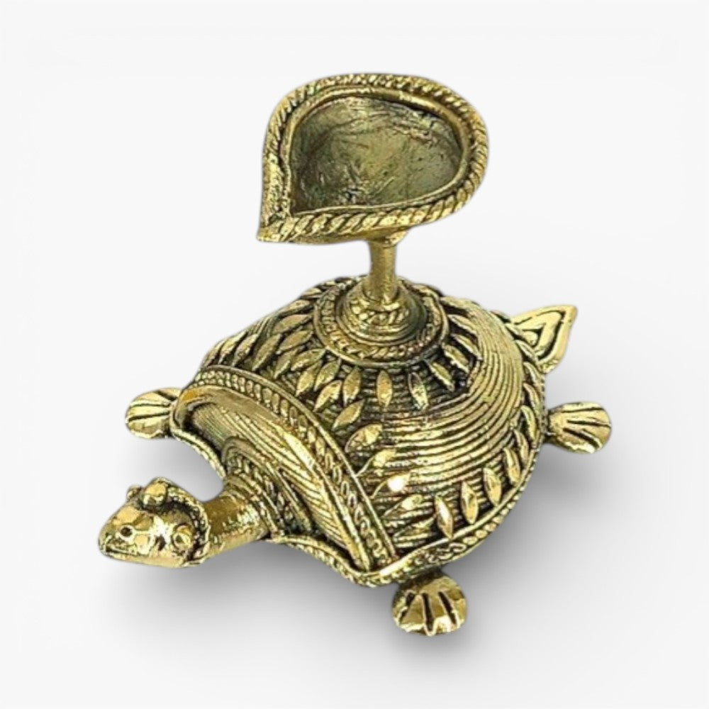 Top angled view of Dhokra art bell metal tortoise diya showcasing detailed shell patterns and diya holder