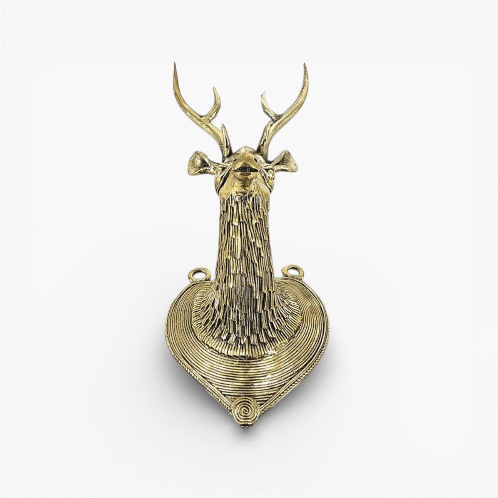Handcrafted brass Bastar Dokra deer head wall hanging photographed from the front showcasing symmetrical design and fine metal texture