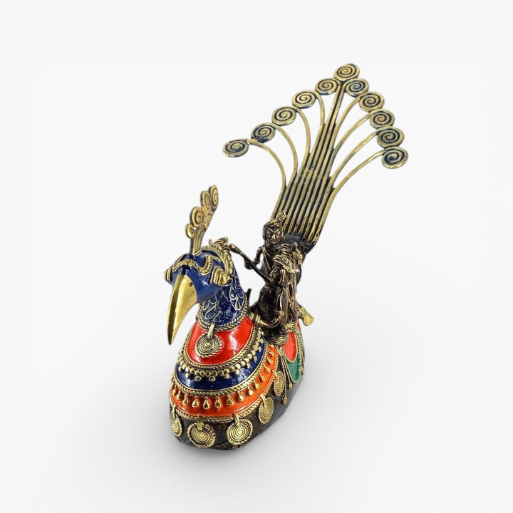 Top angled view of handcrafted Bastar Dhokra brass peacock boat statue highlighting curved tail design and seated fisherman figures