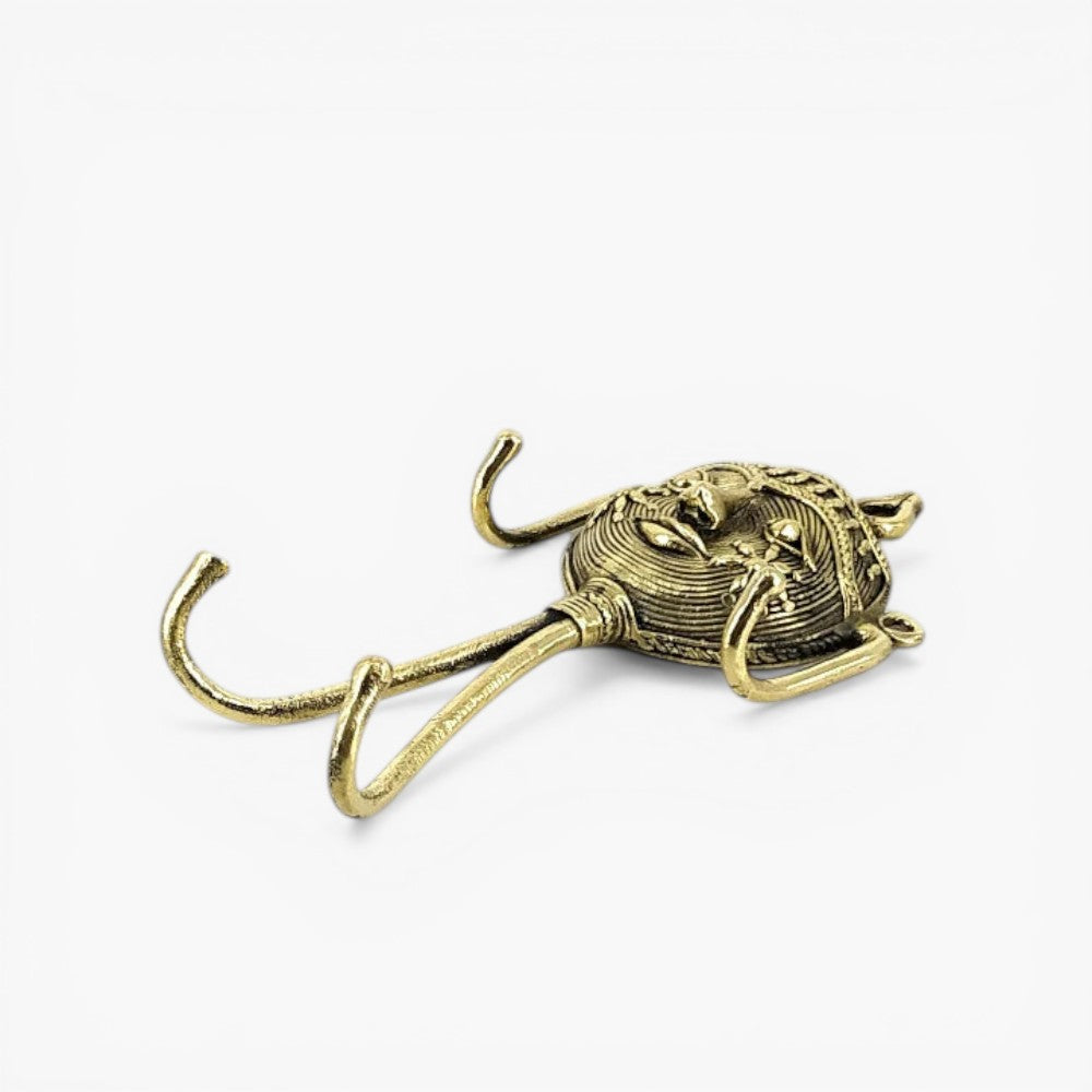 Golden brass handcrafted key holder with mask design