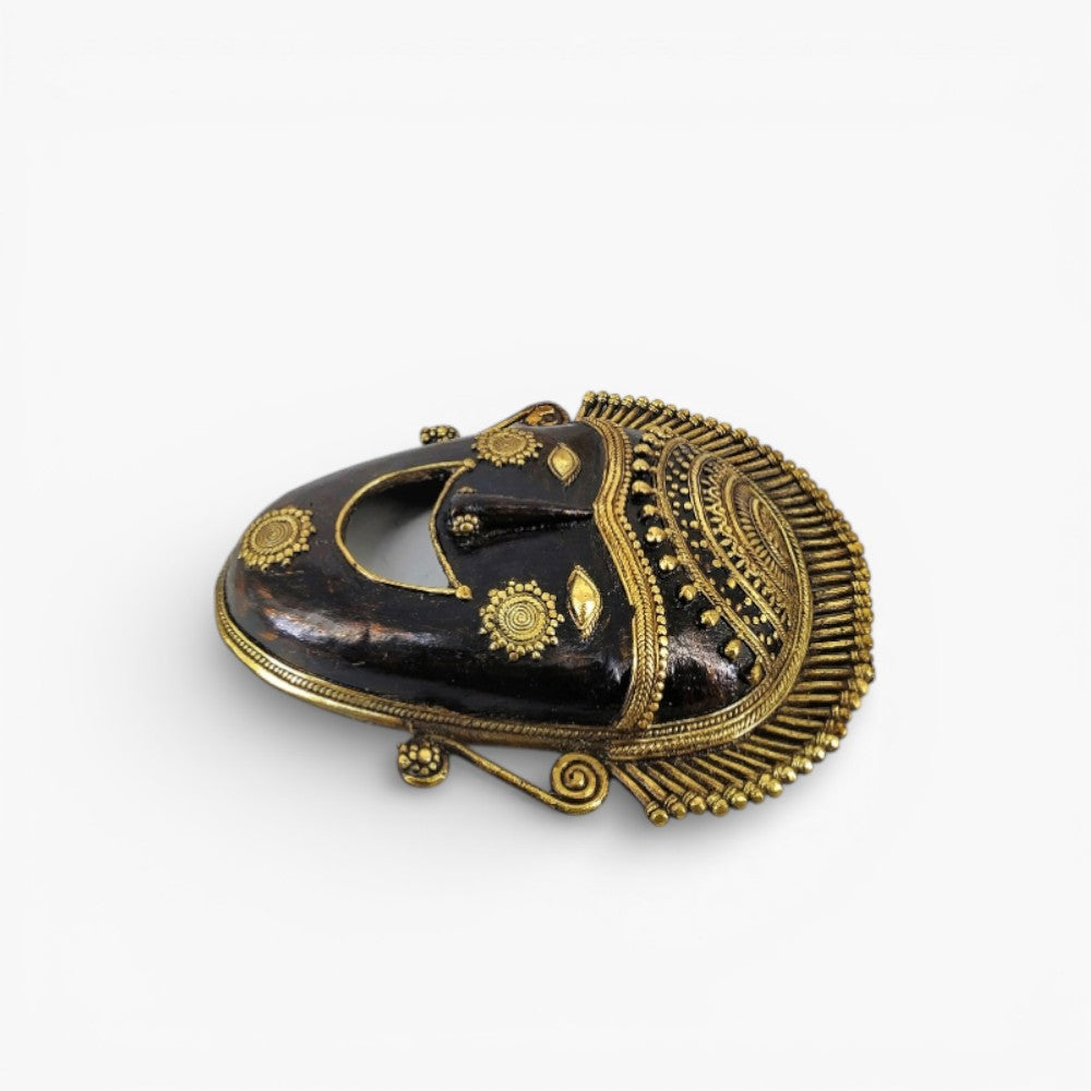 Decorative Bastar art brass mask wall decor with detailed crown design bronze finish side angle view