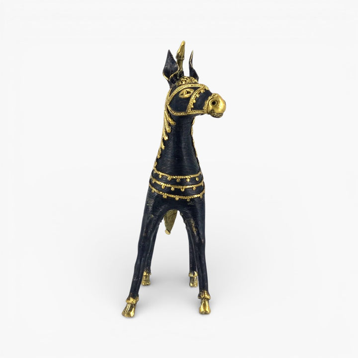Black brass horse figurine with ornamented saddle detailing face view