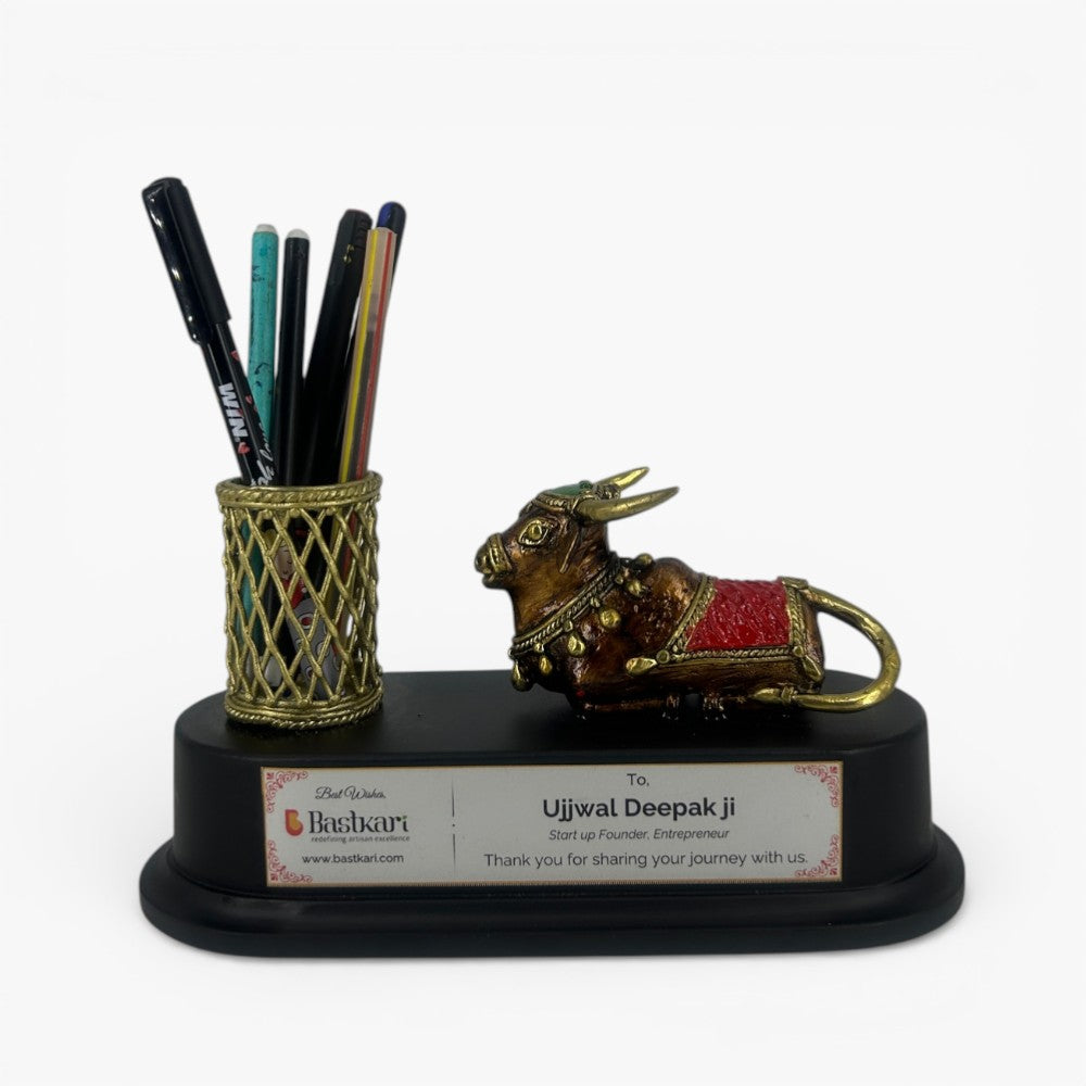 Handcrafted brass Nandi pen holder desk organizer with lattice metal pen stand on black wooden base