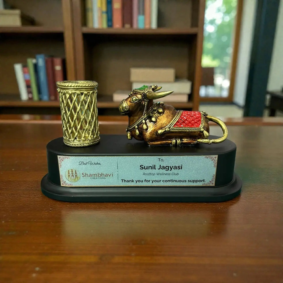 Handcrafted brass Nandi pen holder desk organizer with lattice metal pen stand on black wooden base