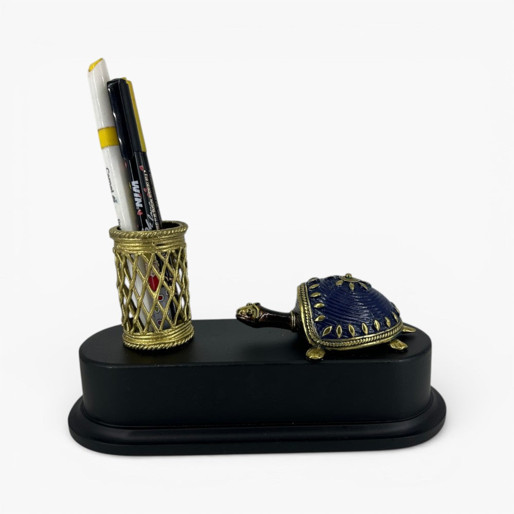 Handcrafted brass turtle pen holder desk organizer with blue shell and lattice pen stand on wooden base