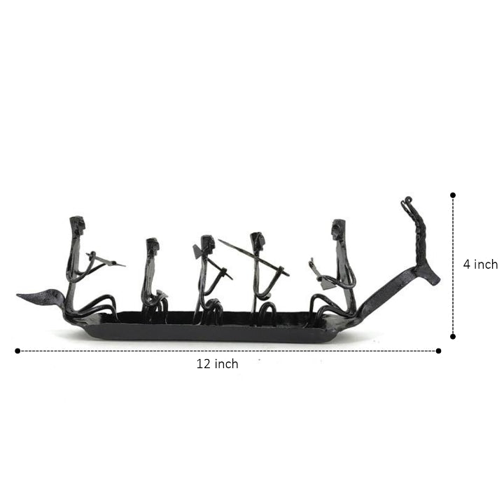 Rear angled view of Bastar tribal art iron Kerala boat tabletop showpiece highlighting traditional riveted metal craftsmanship