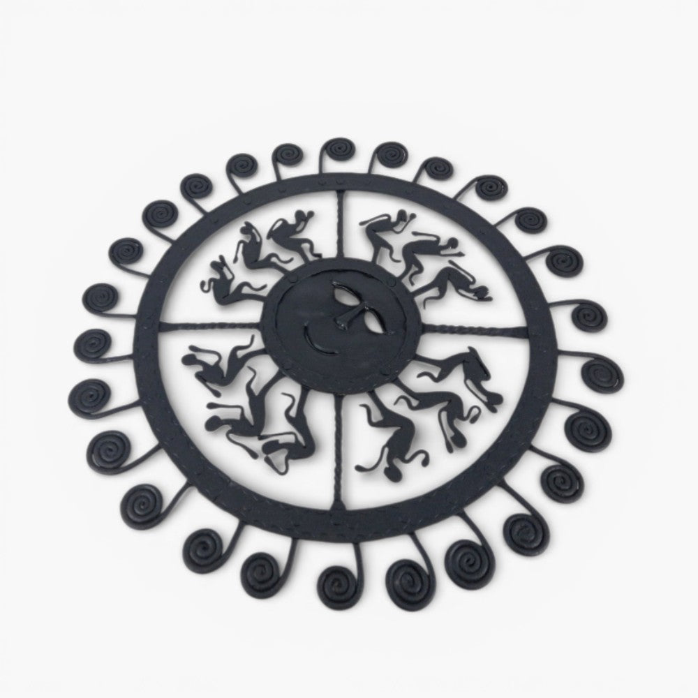 Iron sun wall décor with dancing figures detailed close up