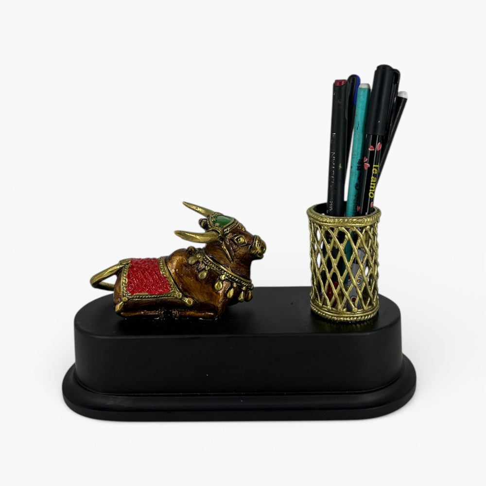 Handmade brass Nandi desk organizer with decorative pen holder and black wooden base office desk accessory