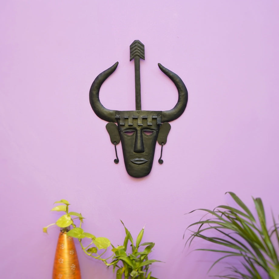 Handmade Madia tribal Bastar iron wall mask in black matte finish displayed on wall in a lifestyle setting for home decor