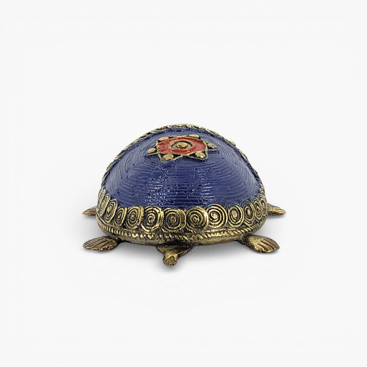 Back view of handcrafted Dhokra bell metal coin tortoise figurine highlighting blue shell design and antique brass accents
